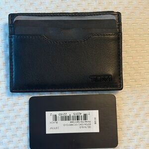 TUMI Delta Money Clip Card Case in black leather.